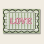 Decorative mat with 'LOVE' text on a striped background