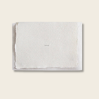 White textured card with 'love' text on a beige background