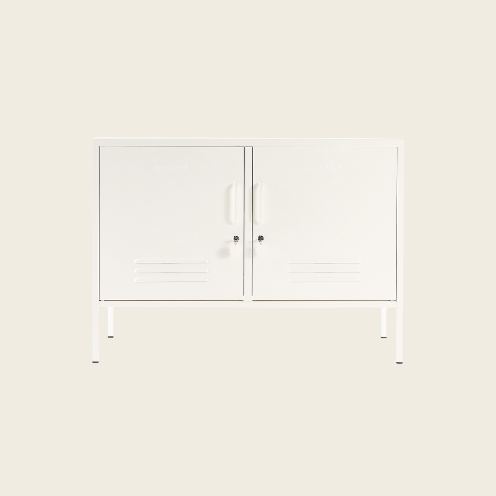 White wall-mounted cabinet with two doors on a light beige background