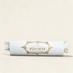 Tube of Magical Rising Wish Paper in white on a warm cream background