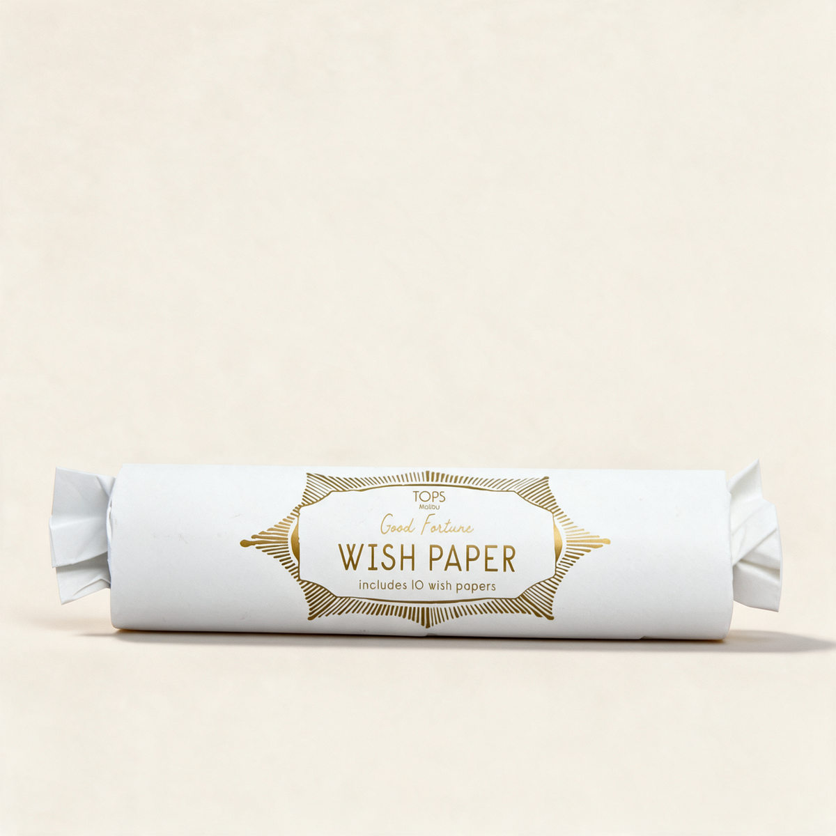 Tube of Magical Rising Wish Paper in white on a warm cream background