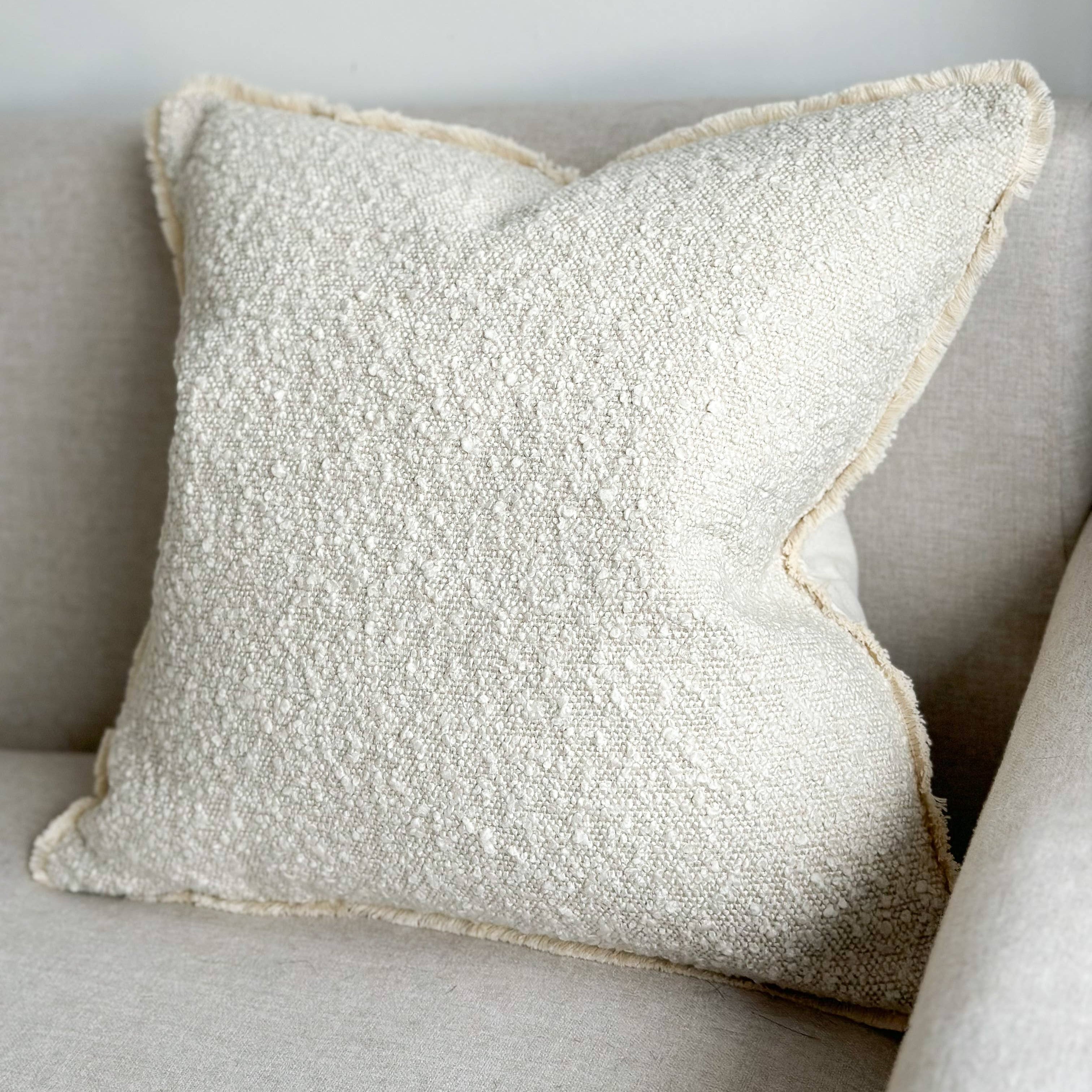 Textured pillow on a neutral-coloured sofa