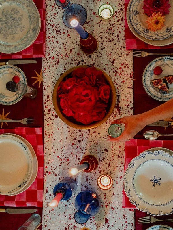 Merlot and gold star cotton tablecloth styled for a gathering