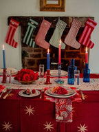 Gold star block print detail on the merlot cotton tablecloth
