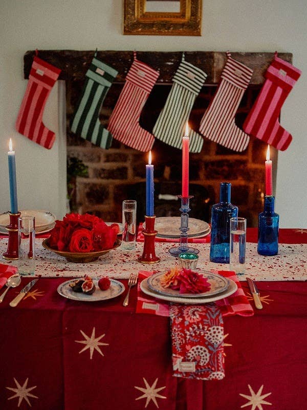 Gold star block print detail on the merlot cotton tablecloth