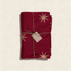 Merlot cotton tablecloth with a gold star block print