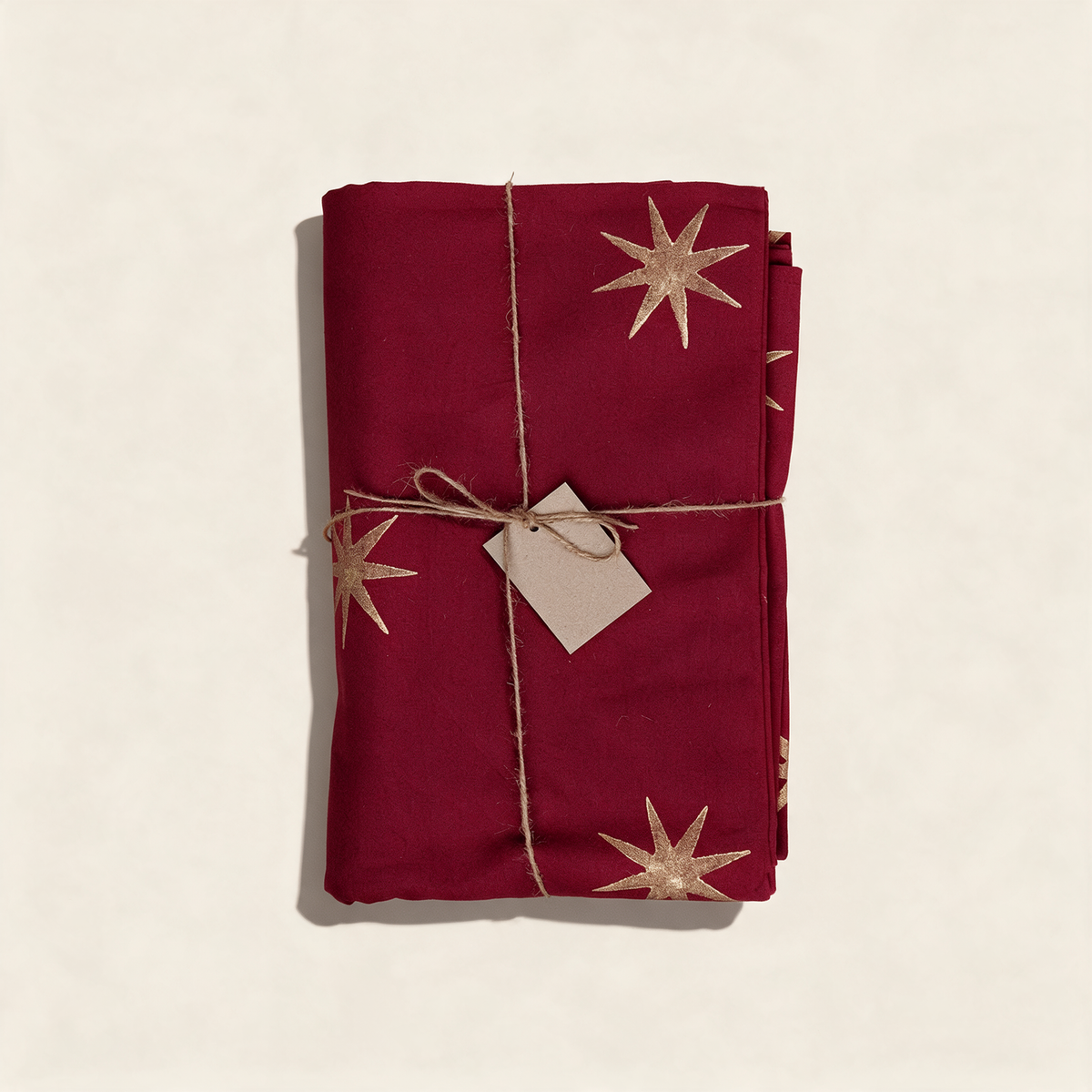 Merlot cotton tablecloth with a gold star block print