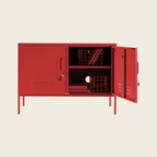 Red metal locker with open doors on a beige background