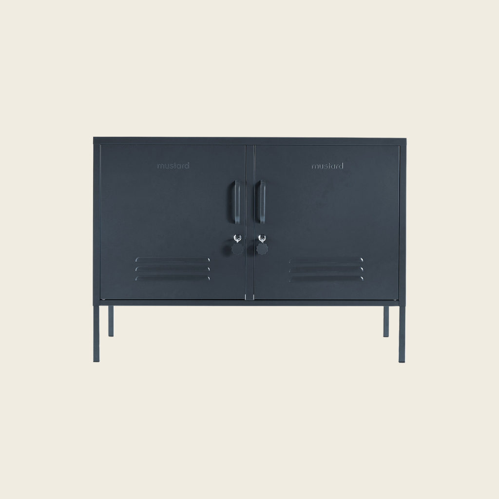 Dark gray metal cabinet with two doors on a beige background