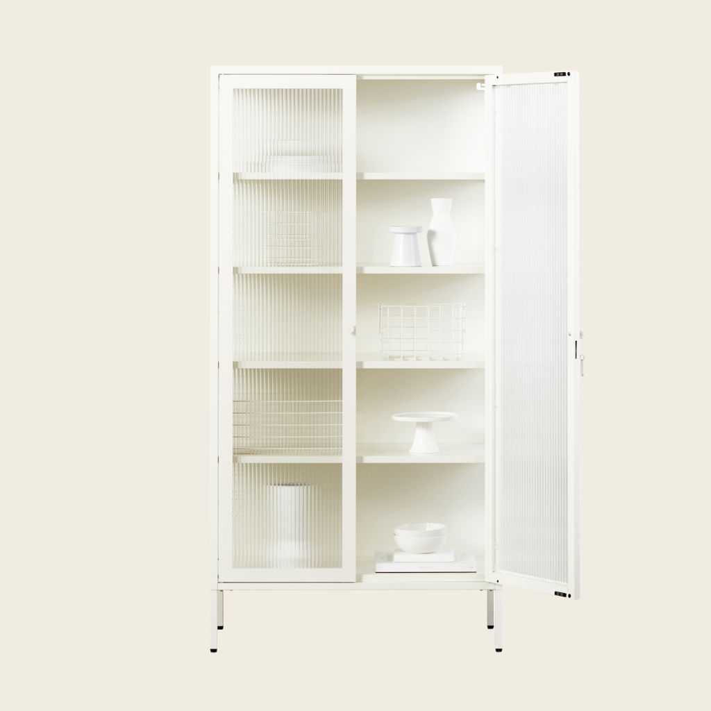 White cabinet with glass doors on a beige background