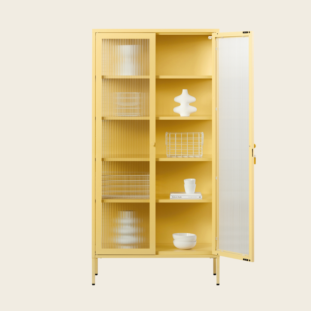 Yellow cabinet with glass doors on a beige background
