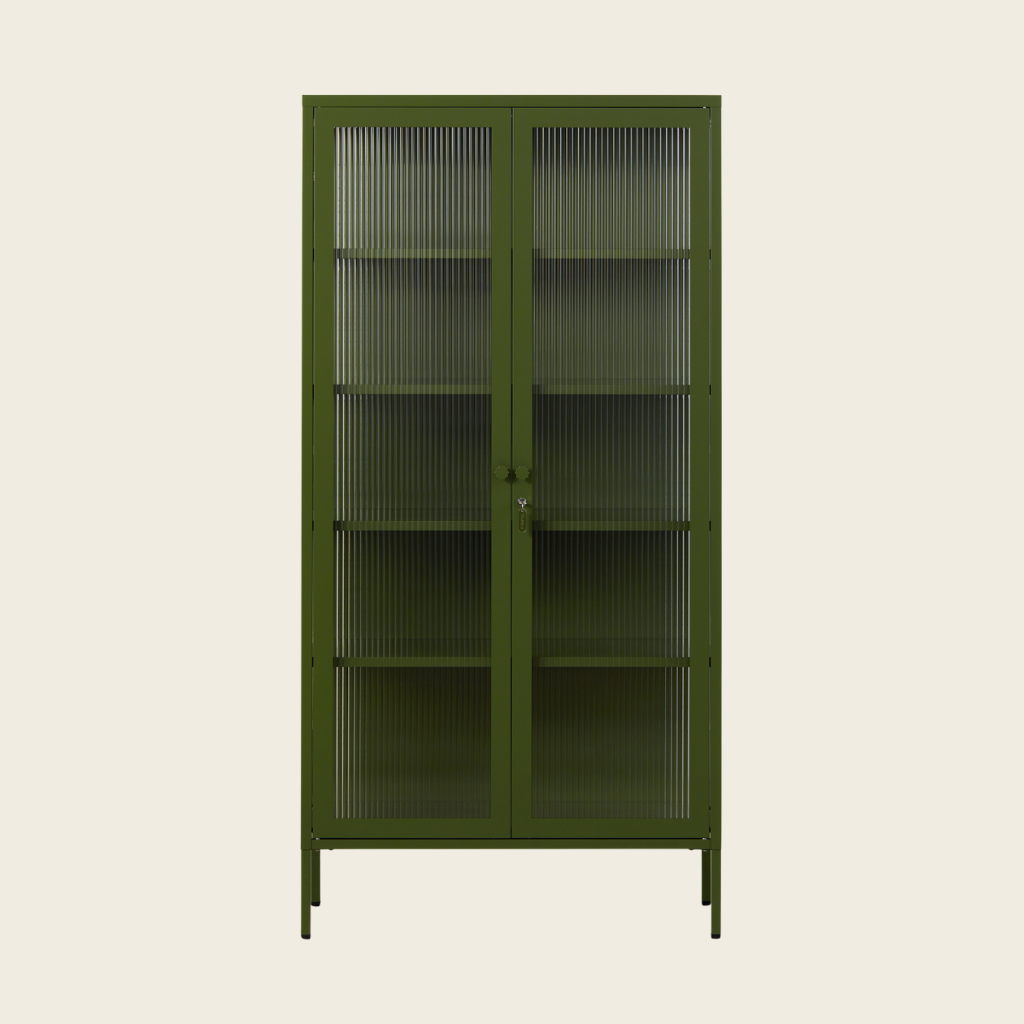 Green metal cabinet with glass doors on a beige background