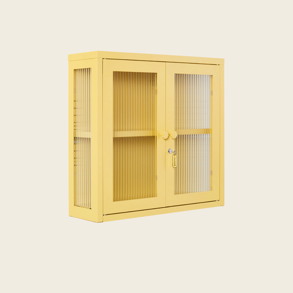 Yellow storage cabinet with glass doors on a beige background