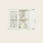 White cabinet with glass doors on a white background