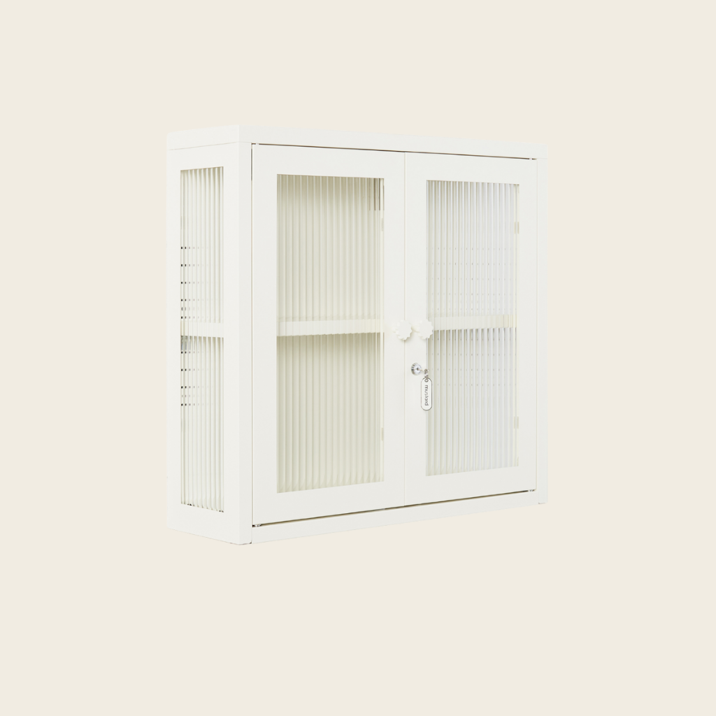 White cabinet with glass doors on a light beige background