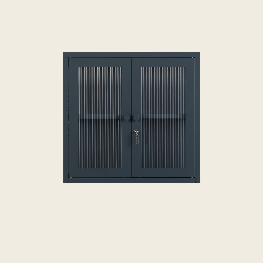 Dark grey cabinet with metal grilles on a beige background