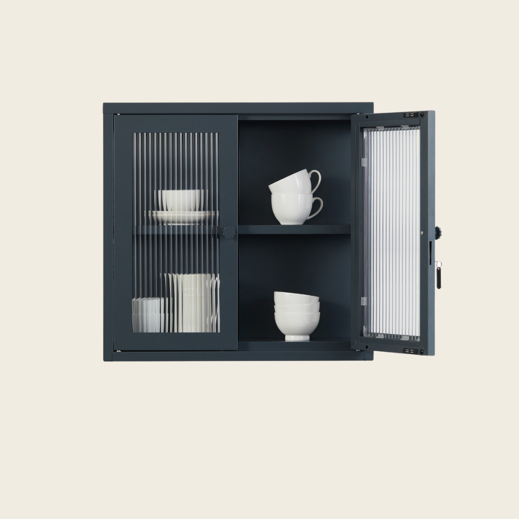 Black cabinet with open door displaying white cups on a beige background