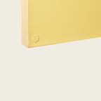 Yellow rectangular object with a logo on a light beige background