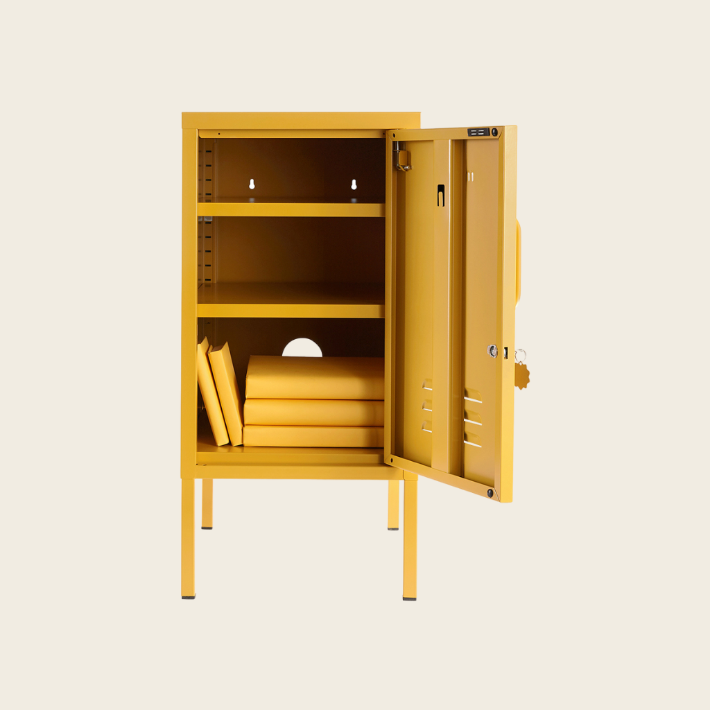 Yellow metal locker with open door on a beige background