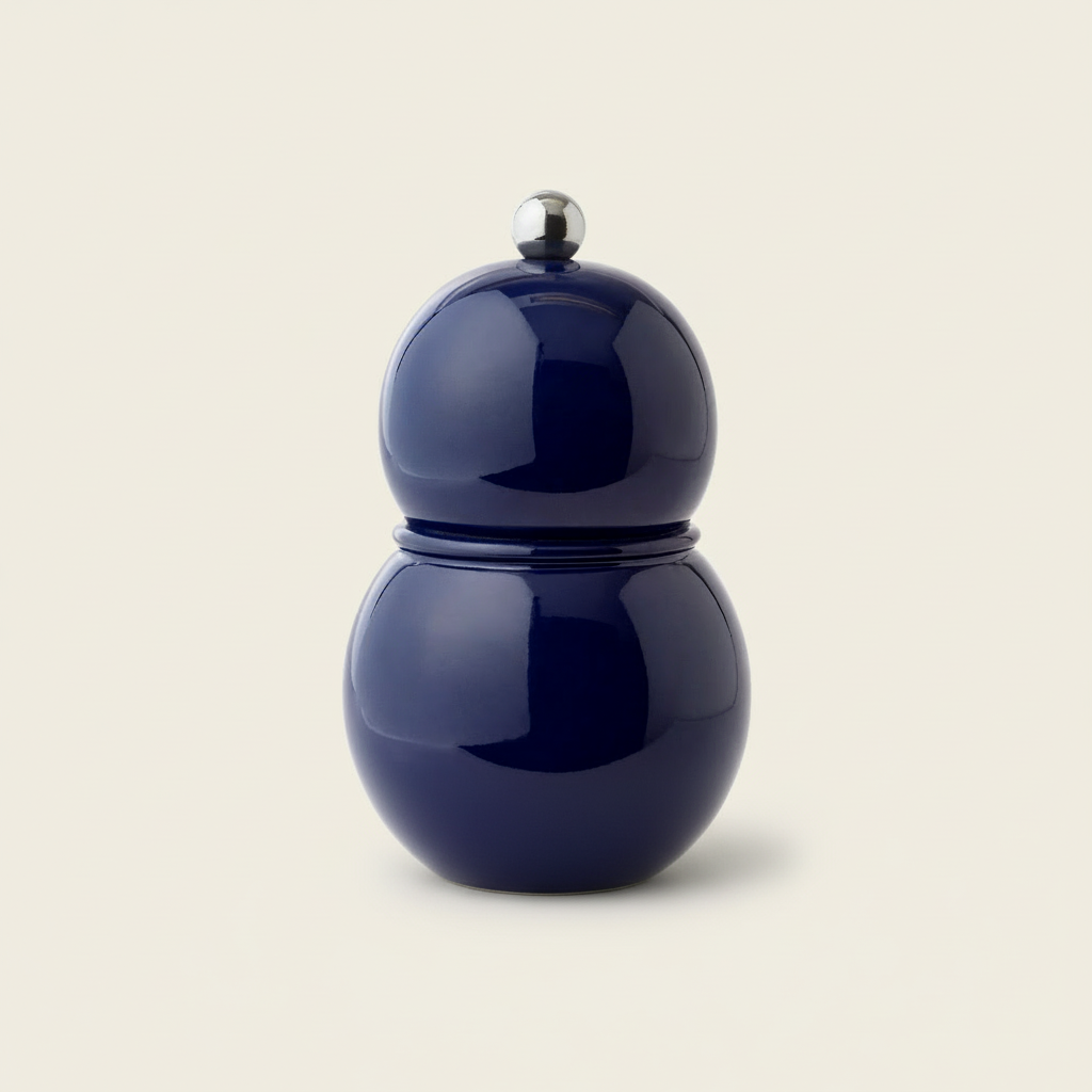 navy chubby salt and pepper mill on light beige background