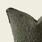 Boucle textured cushion detail on a beige background