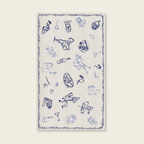White table cloth with blue illustrations and text on a white background