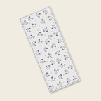 Rectangular towel with blue animal pattern on a white background