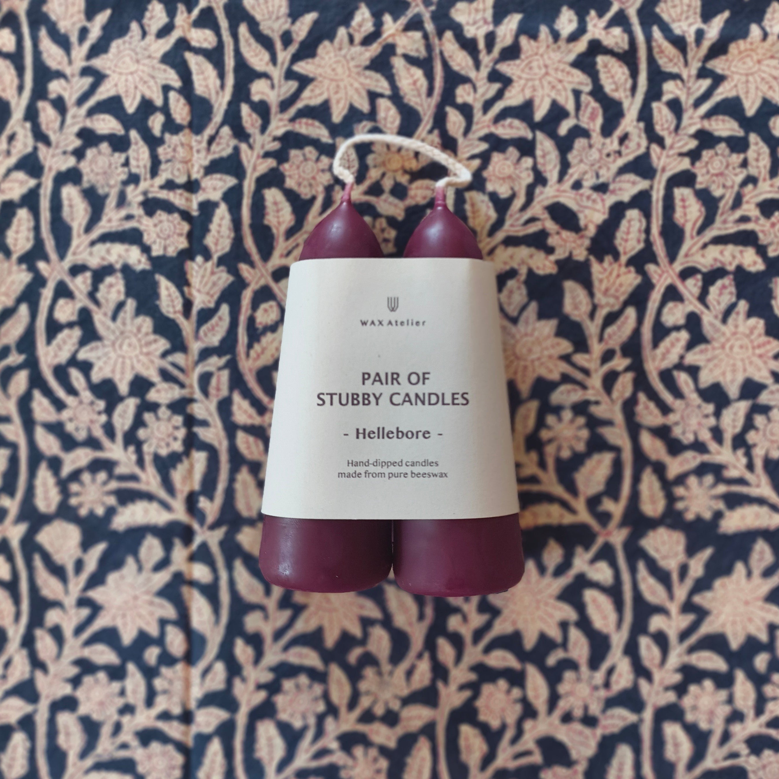 pair of stubby candles in hellebore