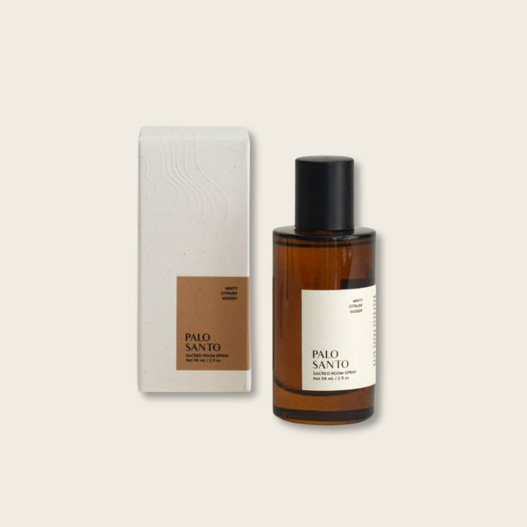 Palo Santo essential oil bottle and packaging on a beige background