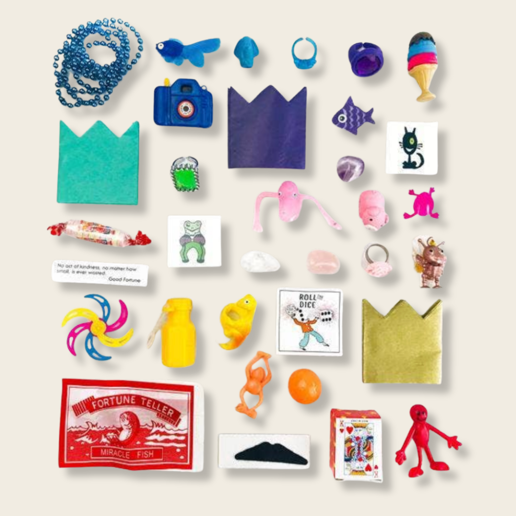 contents of a party cracker on a beige background