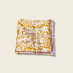 Packaged product with floral design on a wooden surface