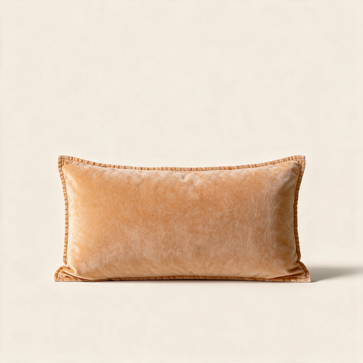 Copper amber velvet lumbar cushion cover, 30 x 60 cm, on a cream background