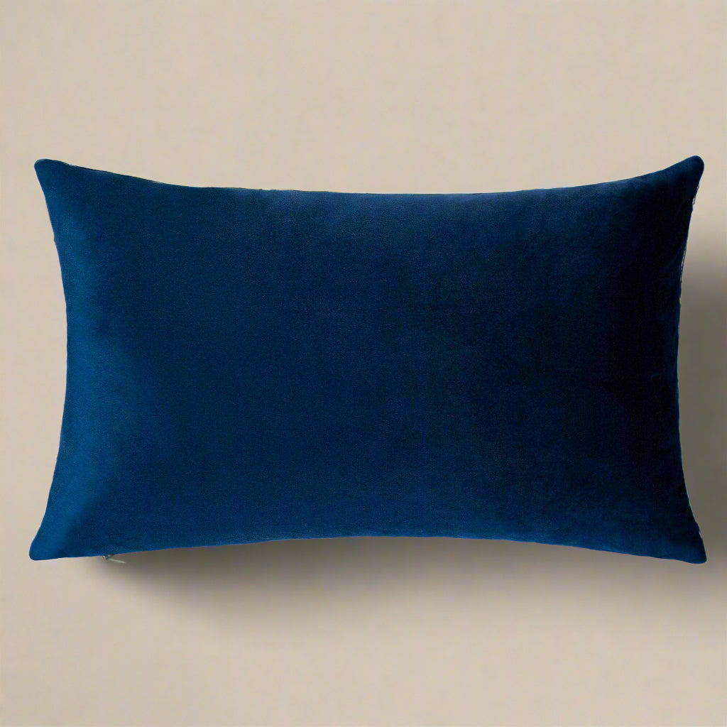 Navy blue pillow on a white background