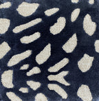 Detail of the Pluma ink rug pile, cream and gold flecks on navy