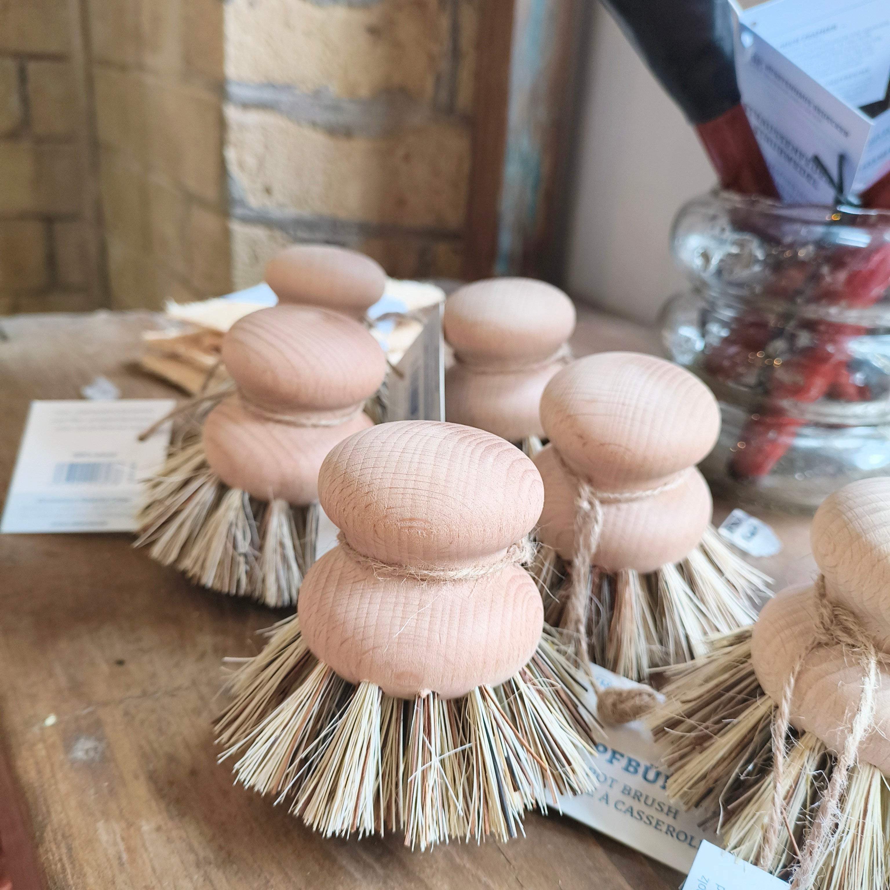 untreated beechwood pot brushes on a shelf