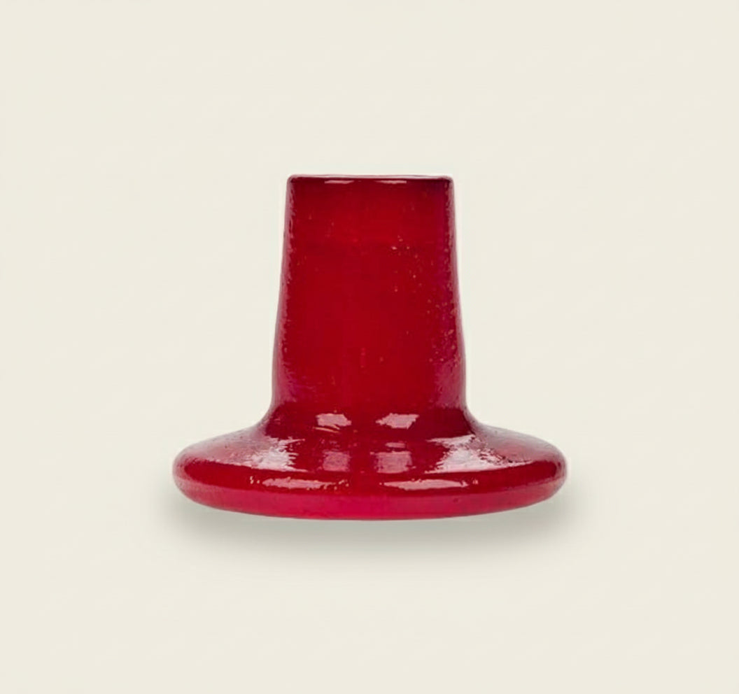 Red ceramic vase on a white background