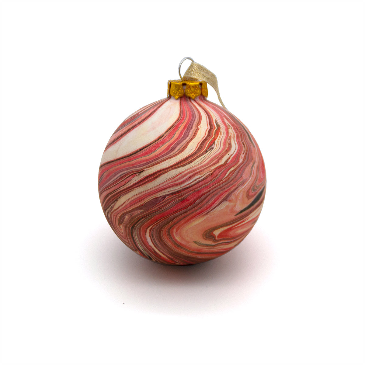Marbled red and beige Christmas ornament on a white background