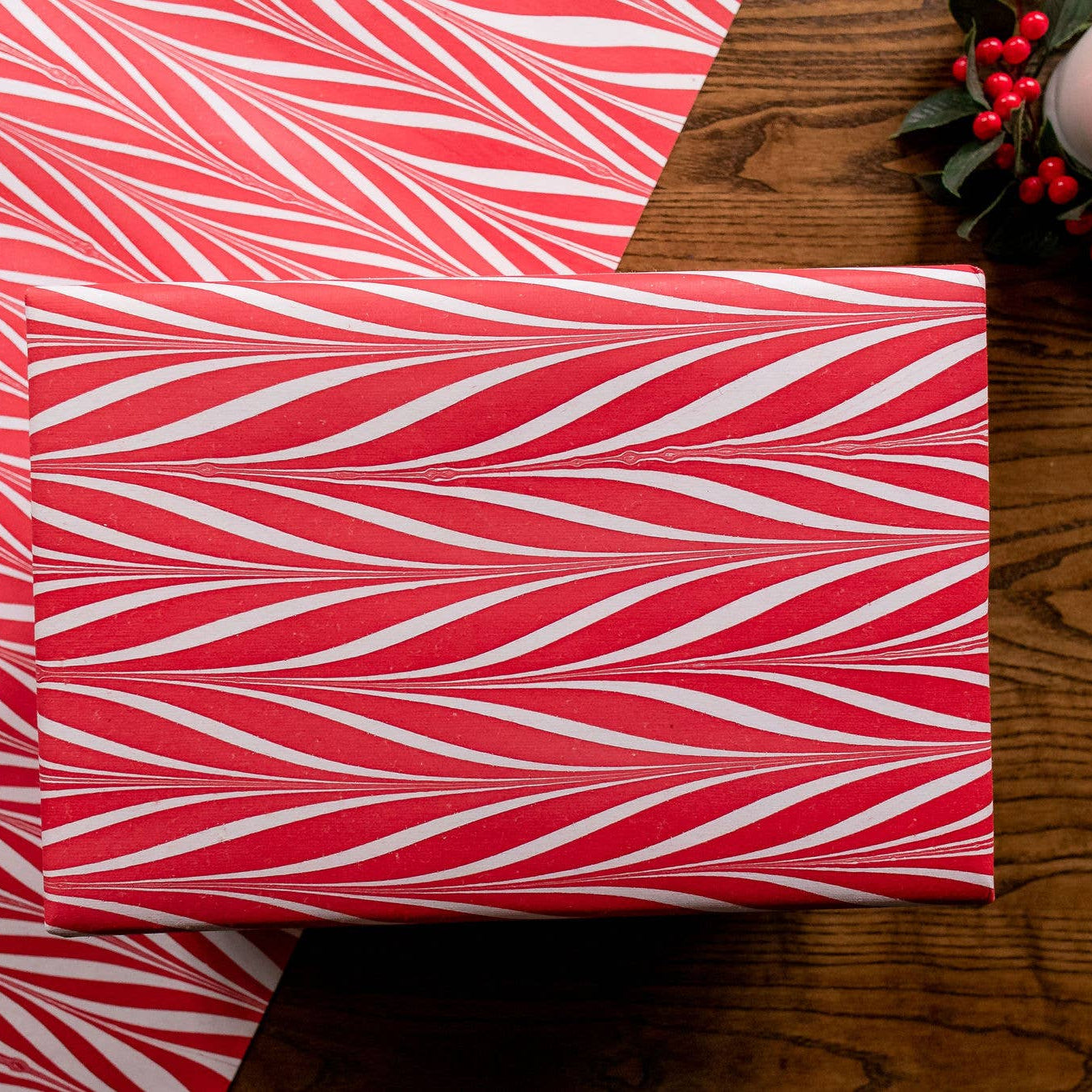 parcel wrapped in red and white marbled wrapping paper