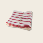 bundle of red and white stripe fabric with a tie