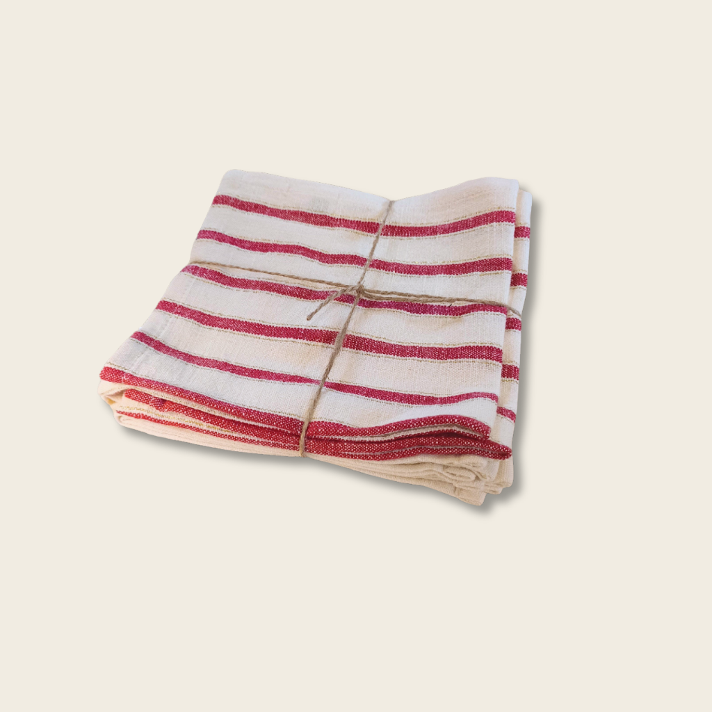 bundle of red and white stripe fabric with a tie