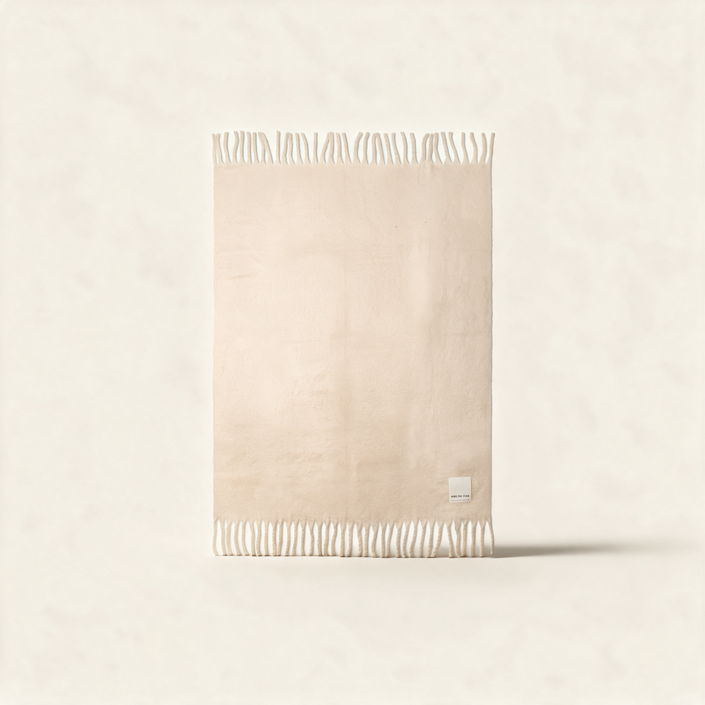 The Reykjavik Throw in pebble beige, a recycled brushed fleece blanket