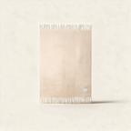 The Reykjavik Throw in pebble beige, a recycled brushed fleece blanket