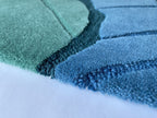 Close up of the Ripple tide rug showing the cut and loop pile and fine wave lines