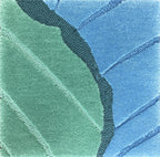 Detail of the Ripple tide rug pile in sea green and ocean blue