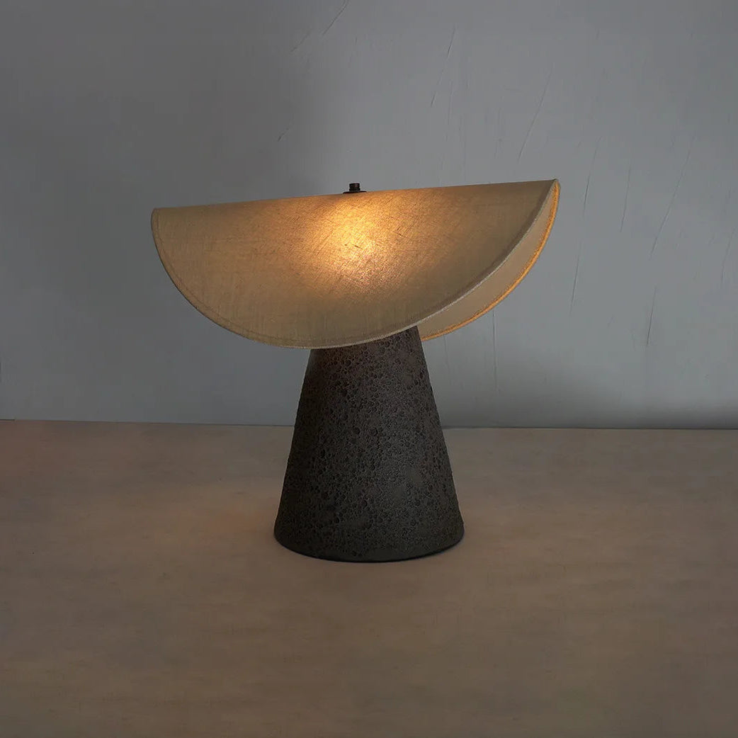 Table lamp with a unique design on a plain background