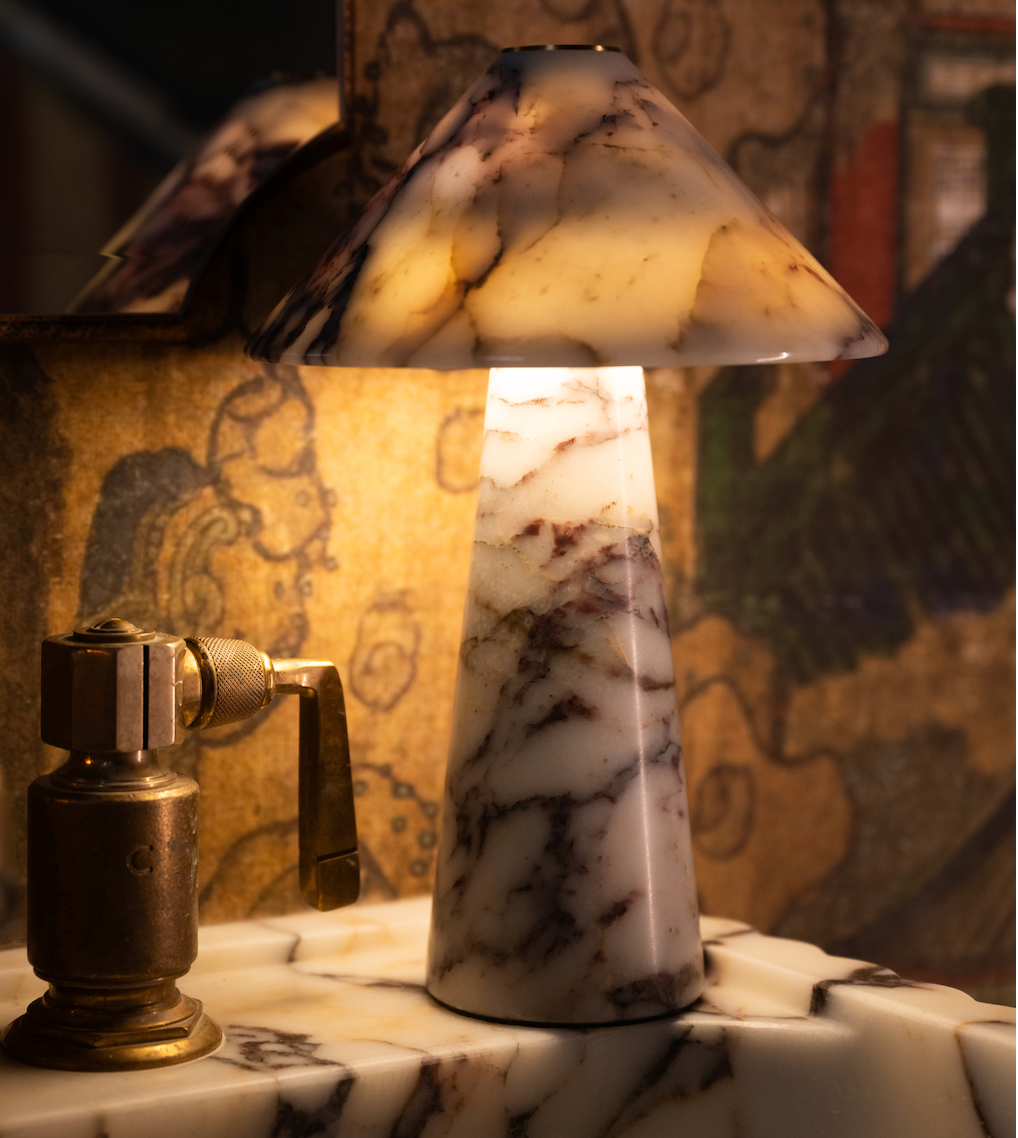 Salcombe marble table light shown with the LED glowing through the marble shade