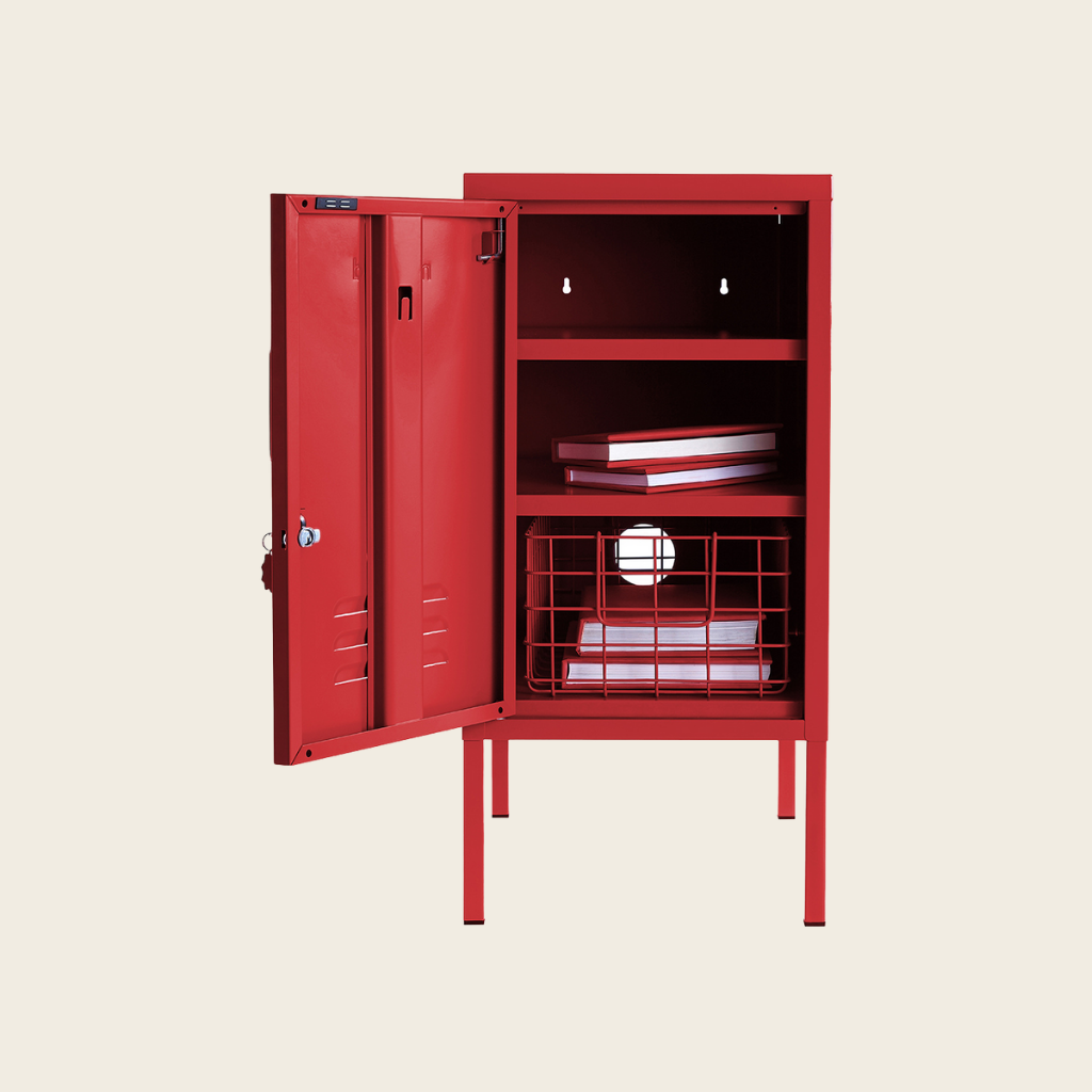 Red storage cabinet with open door on a beige background