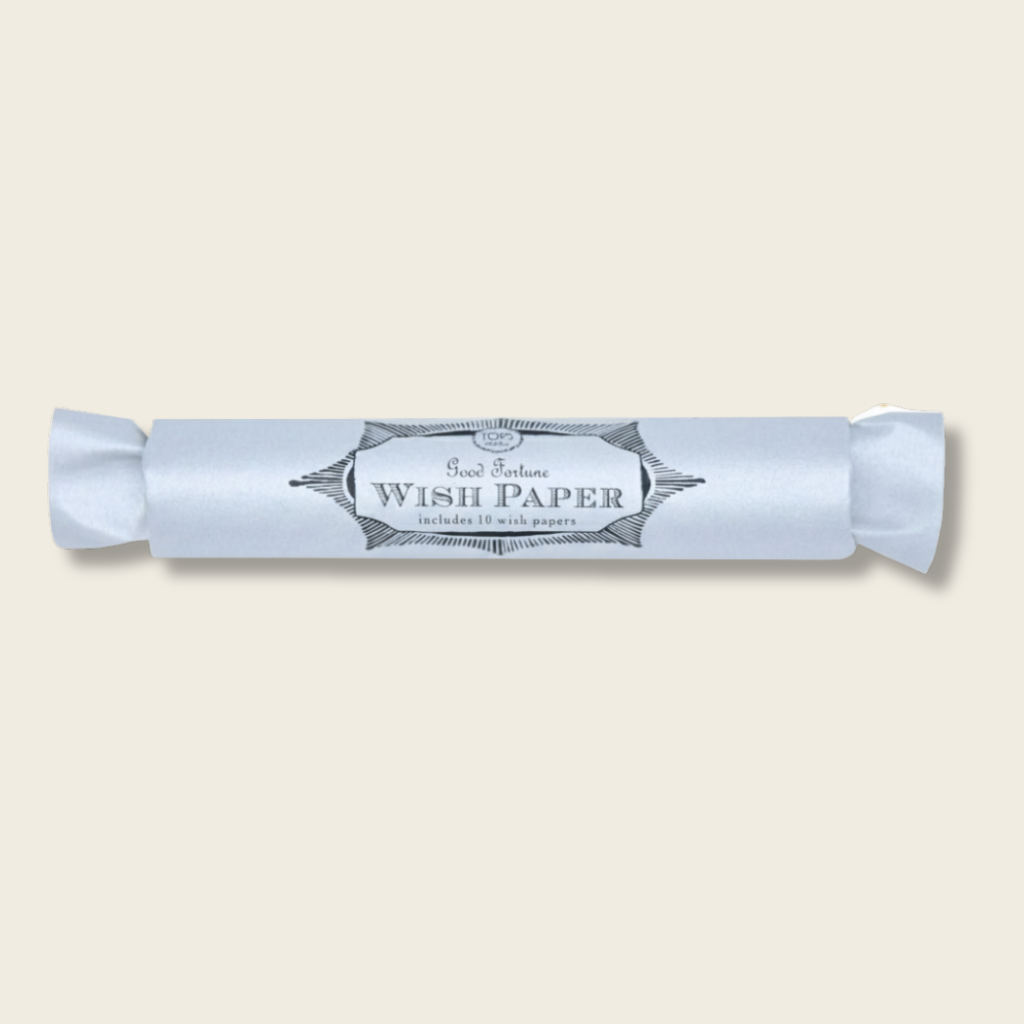 Roll of wish paper with a decorative label on a white background
