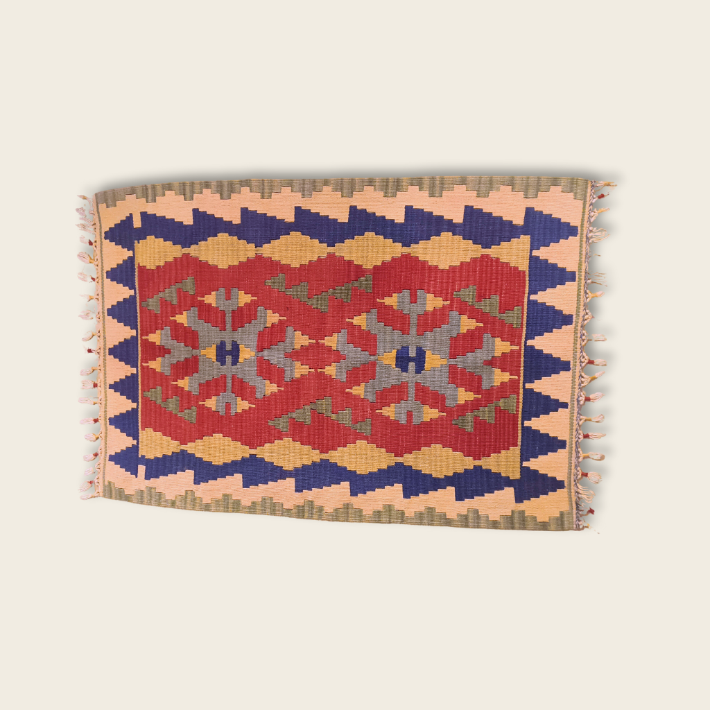 Decorative rug with geometric pattern on a beige background