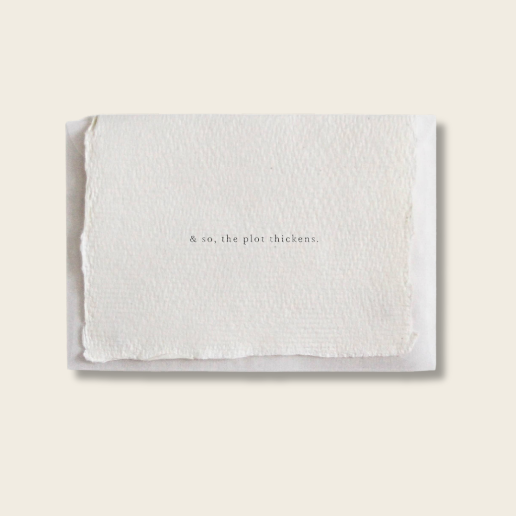 White textured card with text on a light beige background